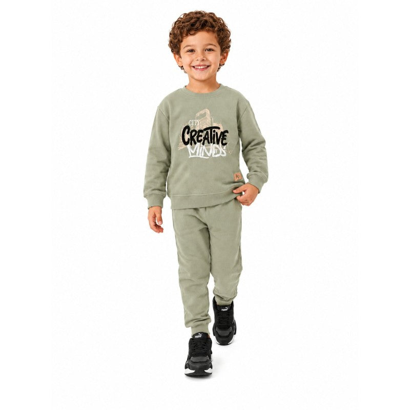Boy wearing a Creative Minds sweatshirt with matching jogger pants