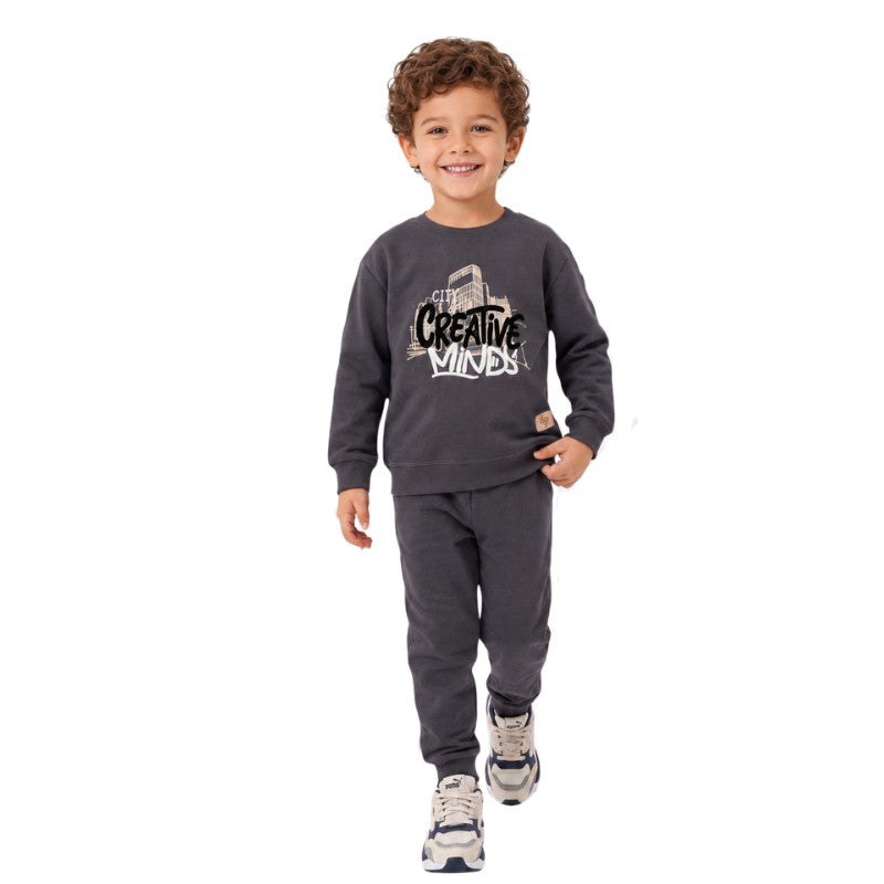 Boy wearing a Creative Minds sweatshirt with matching jogger pants