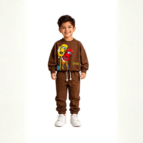 Smiling young boy wearing a brown racing car tracksuit 