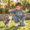 Happy child wearing a soft fleece kids’ tracksuit set playing outdoors 