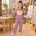 Girl wearing a fleece mauve teddy bear sweatshirt and matching pants 