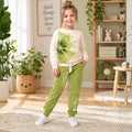 Young girl wearing a cream sweatshirt with floral print and matching jogger pants for kids