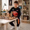 Boy wearing a Lightning McQueen sweatshirt and matching jogger pants