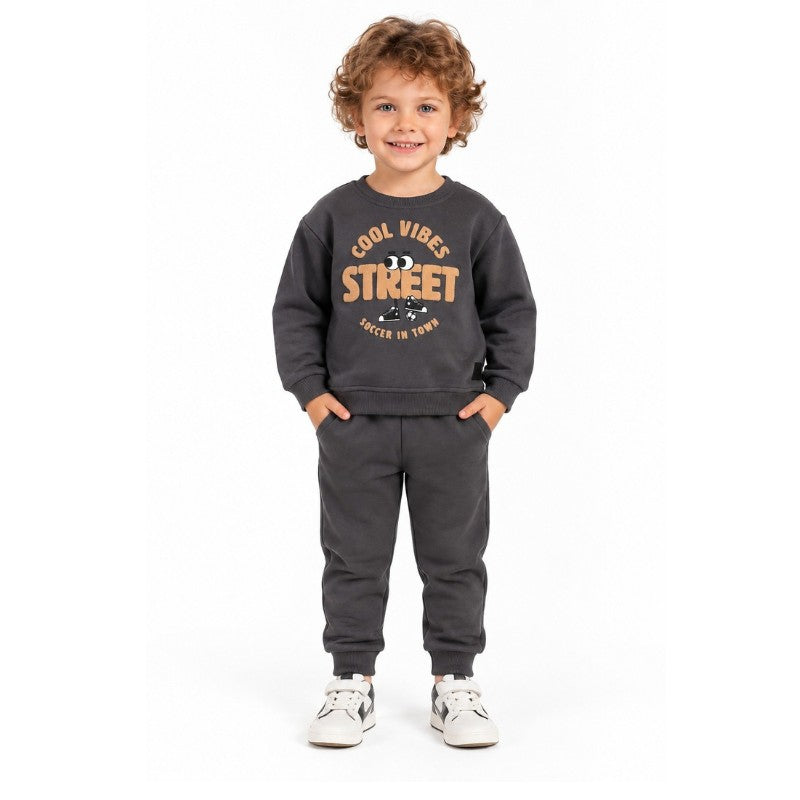 Young boy wearing a grey Cool Vibes Street graphic sweatshirt with matching jogger pants, a sporty kids tracksuit for active play