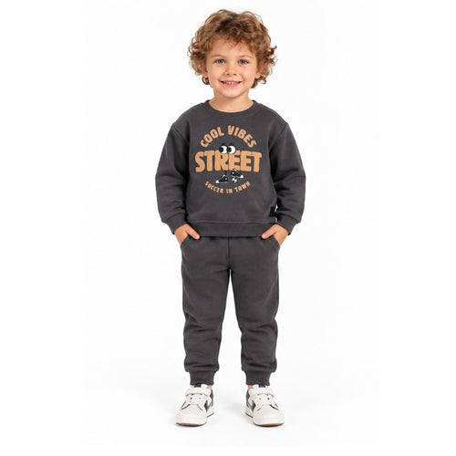 Young boy wearing a grey Cool Vibes Street graphic sweatshirt with matching jogger pants, a sporty kids tracksuit for active play