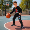 Young boy wearing a Spidey sweatshirt with matching jogger pants and white sneakers