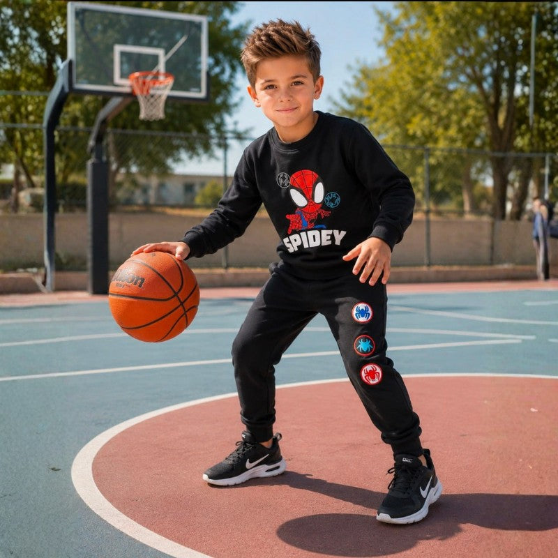 Young boy wearing a Spidey sweatshirt with matching jogger pants and white sneakers