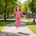 Young girl wearing a floral tracksuit 