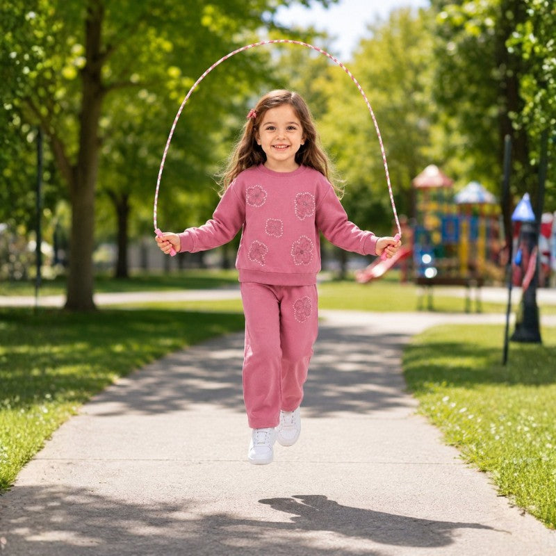 Young girl wearing a floral tracksuit 