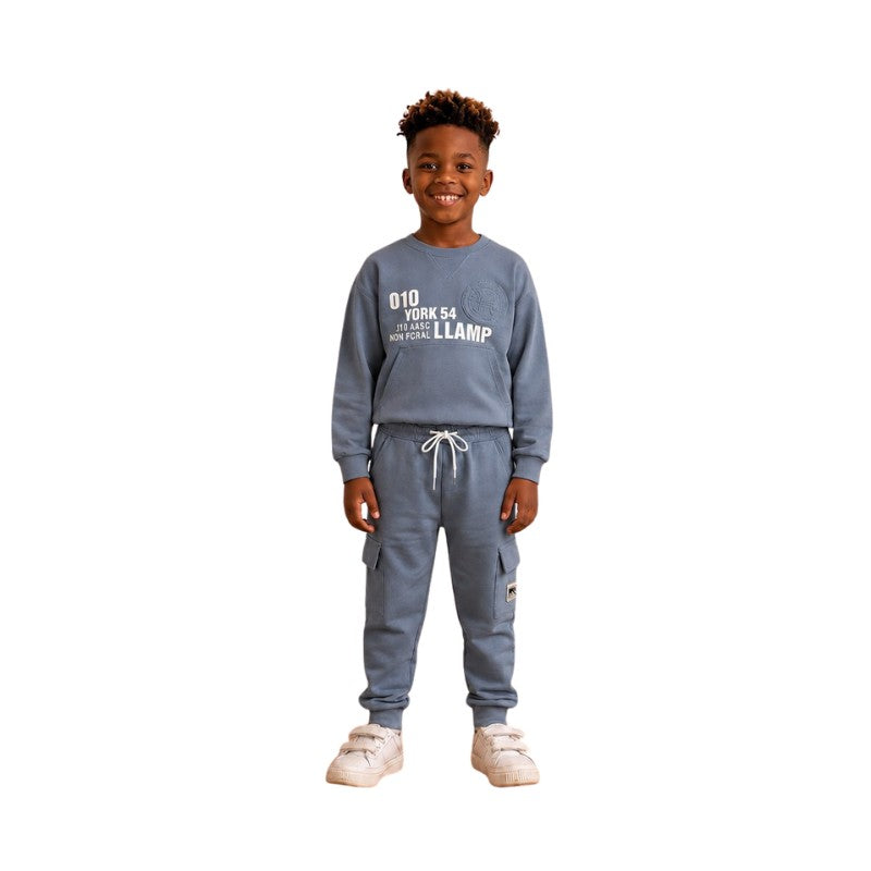 Young boy wearing a graphic sweatshirt with matching cargo jogger pants.