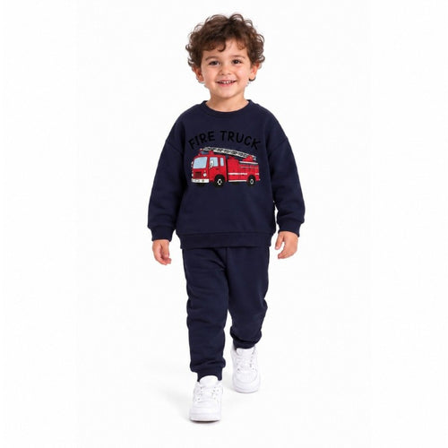 Young boy wearing a fire truck graphic sweatshirt and matching jogger pants, a comfortable kids casual tracksuit set