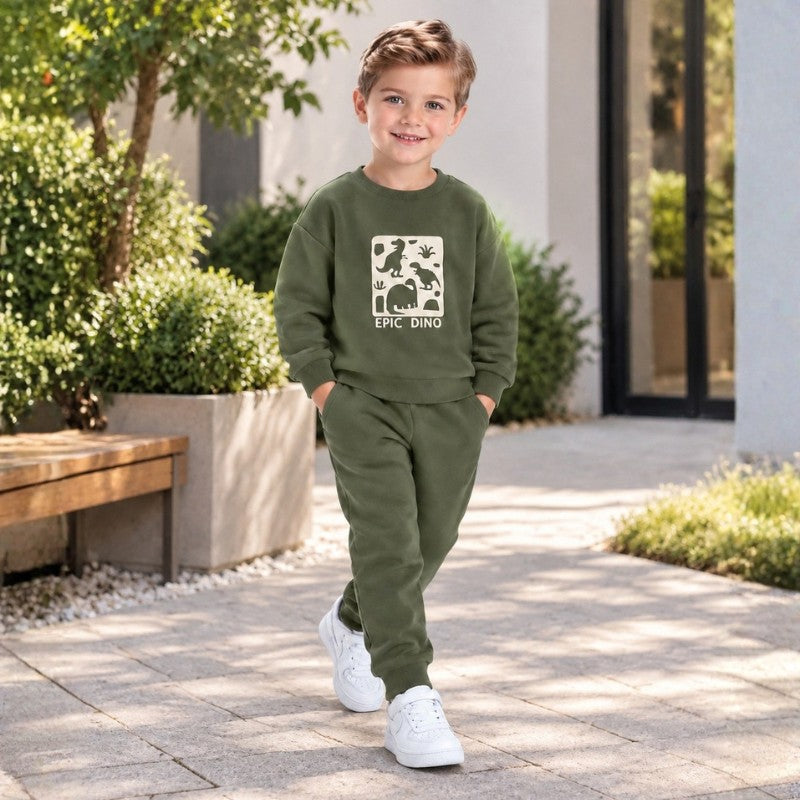 Young boy wearing a green Epic Dino graphic sweatshirt with matching jogger pants, a stylish kids casual tracksuit set