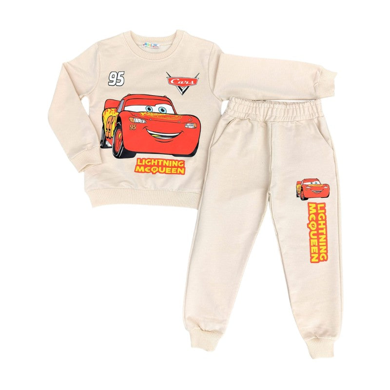 A two-piece children's sweatshirt and jogger set in cream, featuring a Cars Lightning McQueen graphic on the sweatshirt and matching graphics on the joggers.