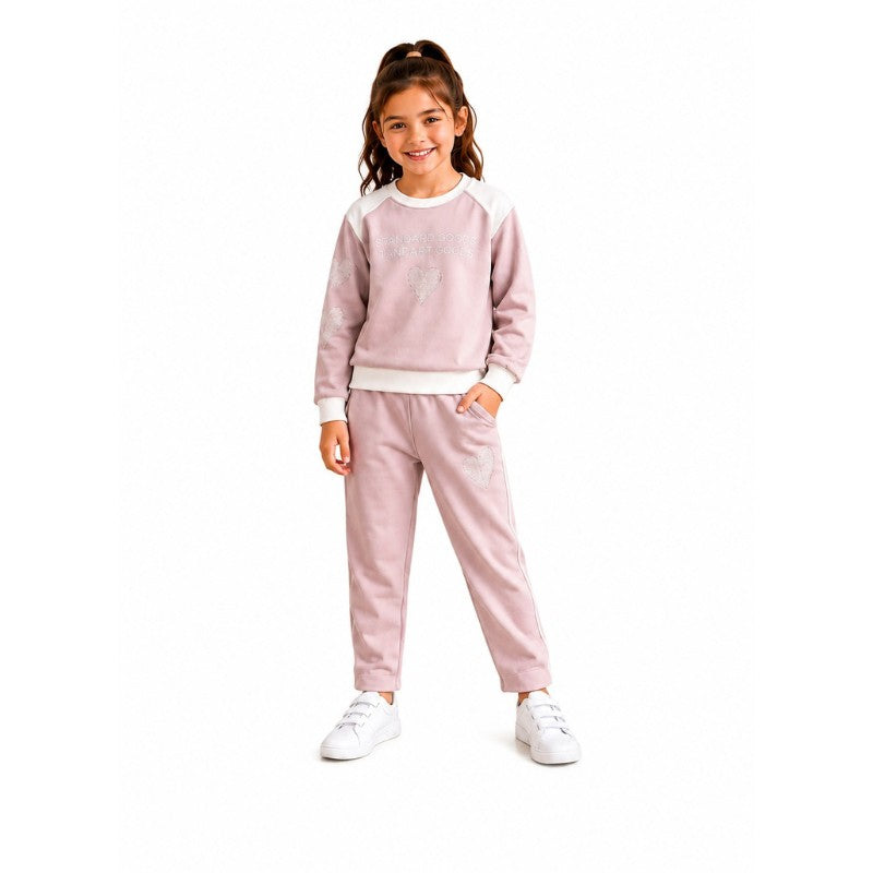 Young girl wearing a sweatshirt and matching jogger pants