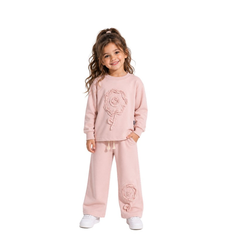 Young girl wearing a floral tracksuit 