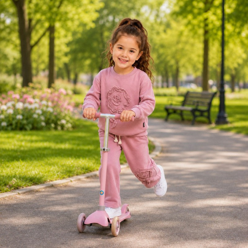 Young girl wearing a floral tracksuit 
