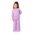 Young girl wearing a graphic tracksuit set 