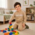 Young boy wearing a sweatshirt and matching joggers