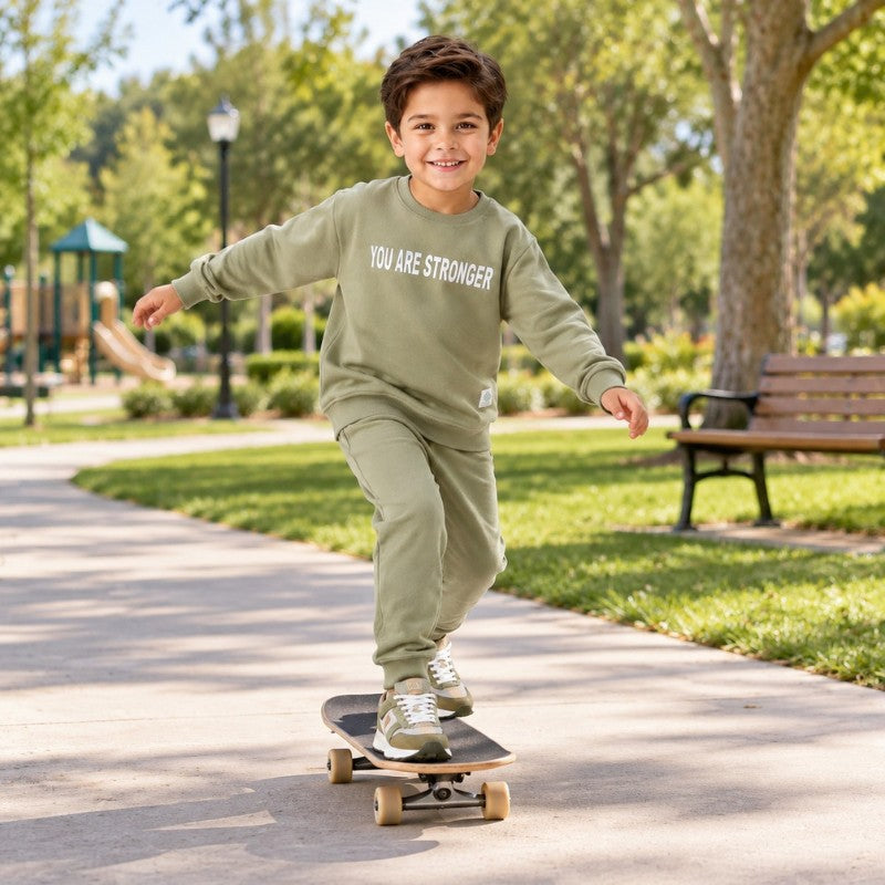 Young boy wearing a sweatshirt and matching joggers