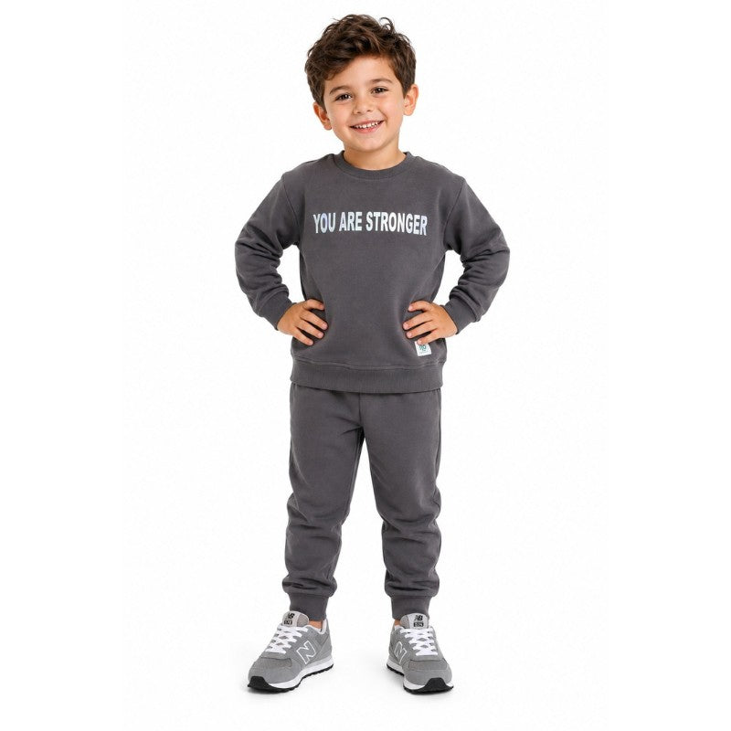 Young boy wearing a sweatshirt and matching joggers