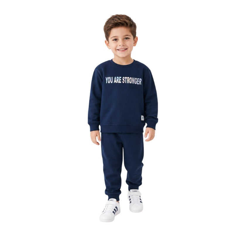 Young boy wearing a sweatshirt and matching joggers