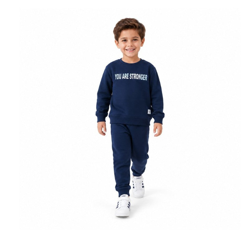 Young boy wearing a sweatshirt and matching joggers